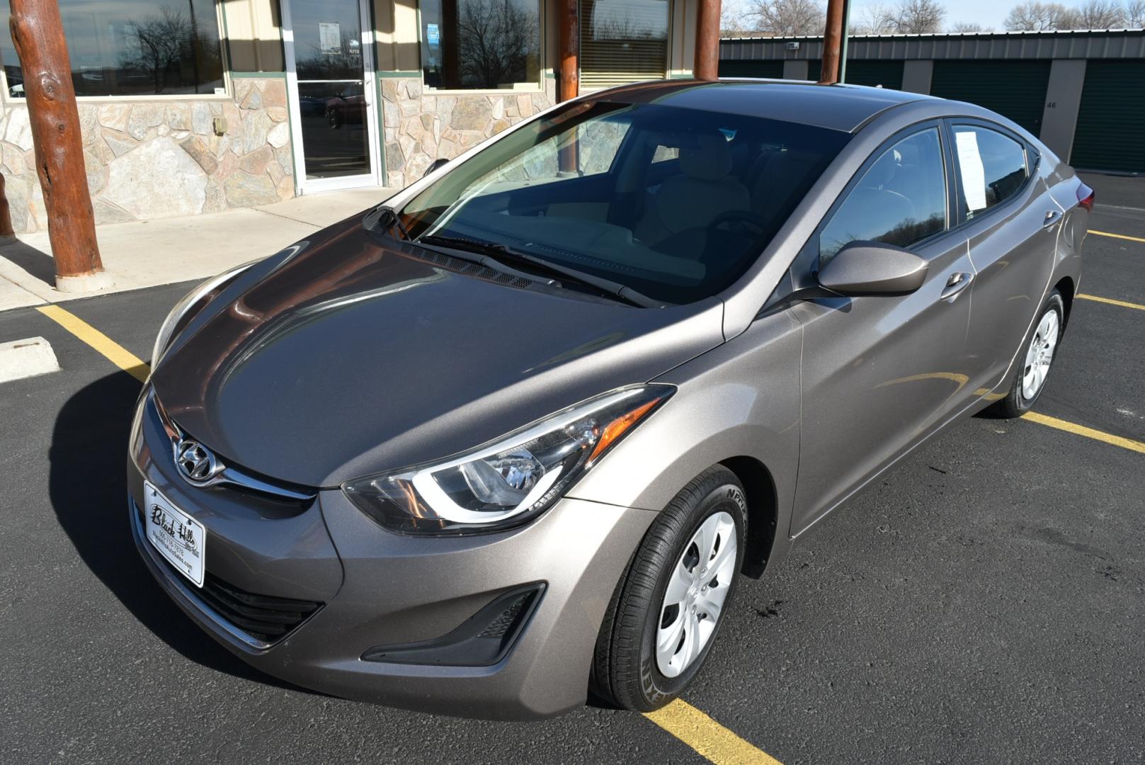 2016 Bronze Hyundai Elantra SE (5NPDH4AE3GH) with an 1.8L 4 Cyl engine, 6-Speed Automatic transmission, located at 1600 E Hwy 44, Rapid City, SD, 57703, (605) 716-7878, 44.070232, -103.171410 - Photo#2